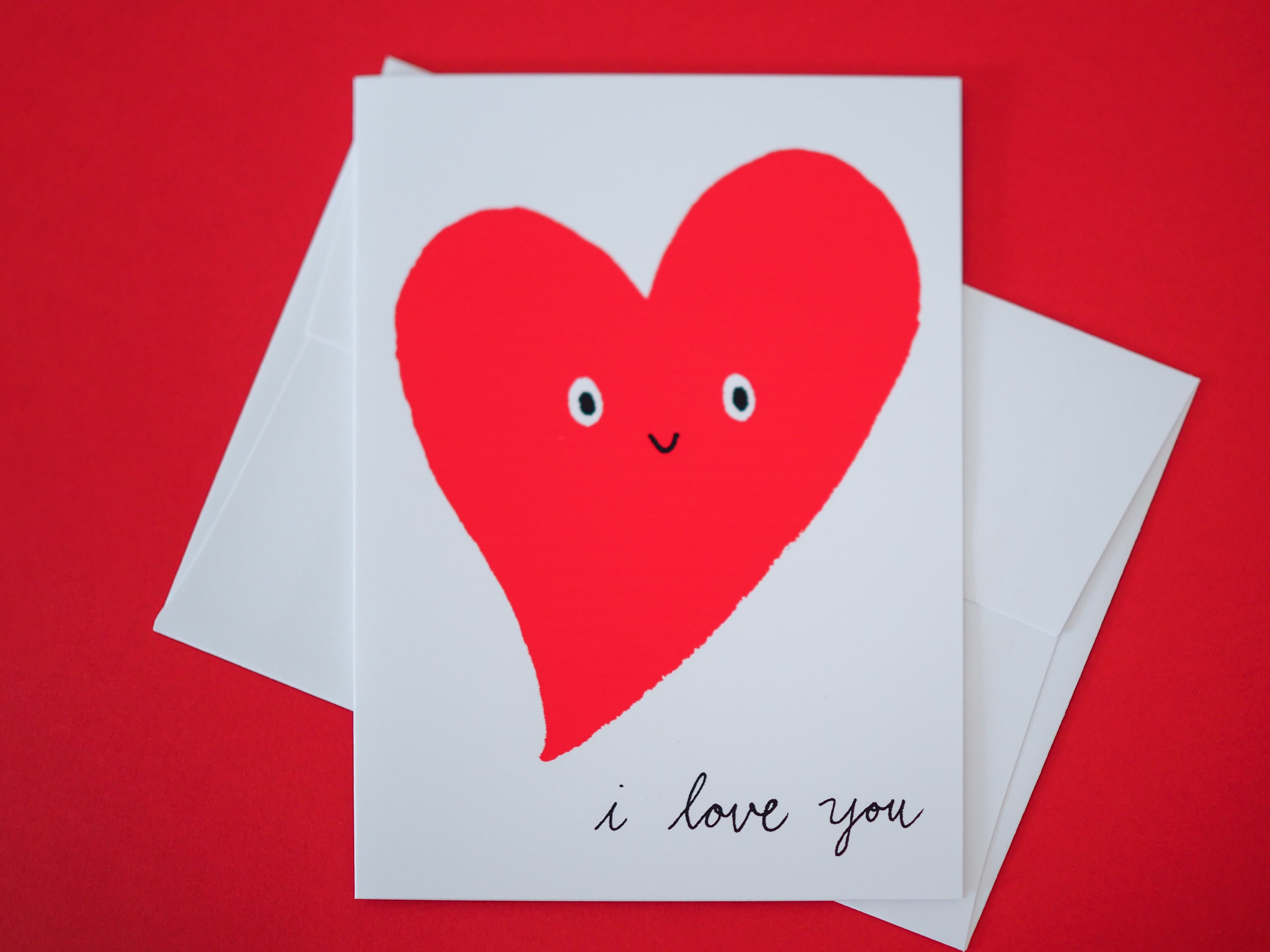 Card with a red heart and 'I love you' text on a red background