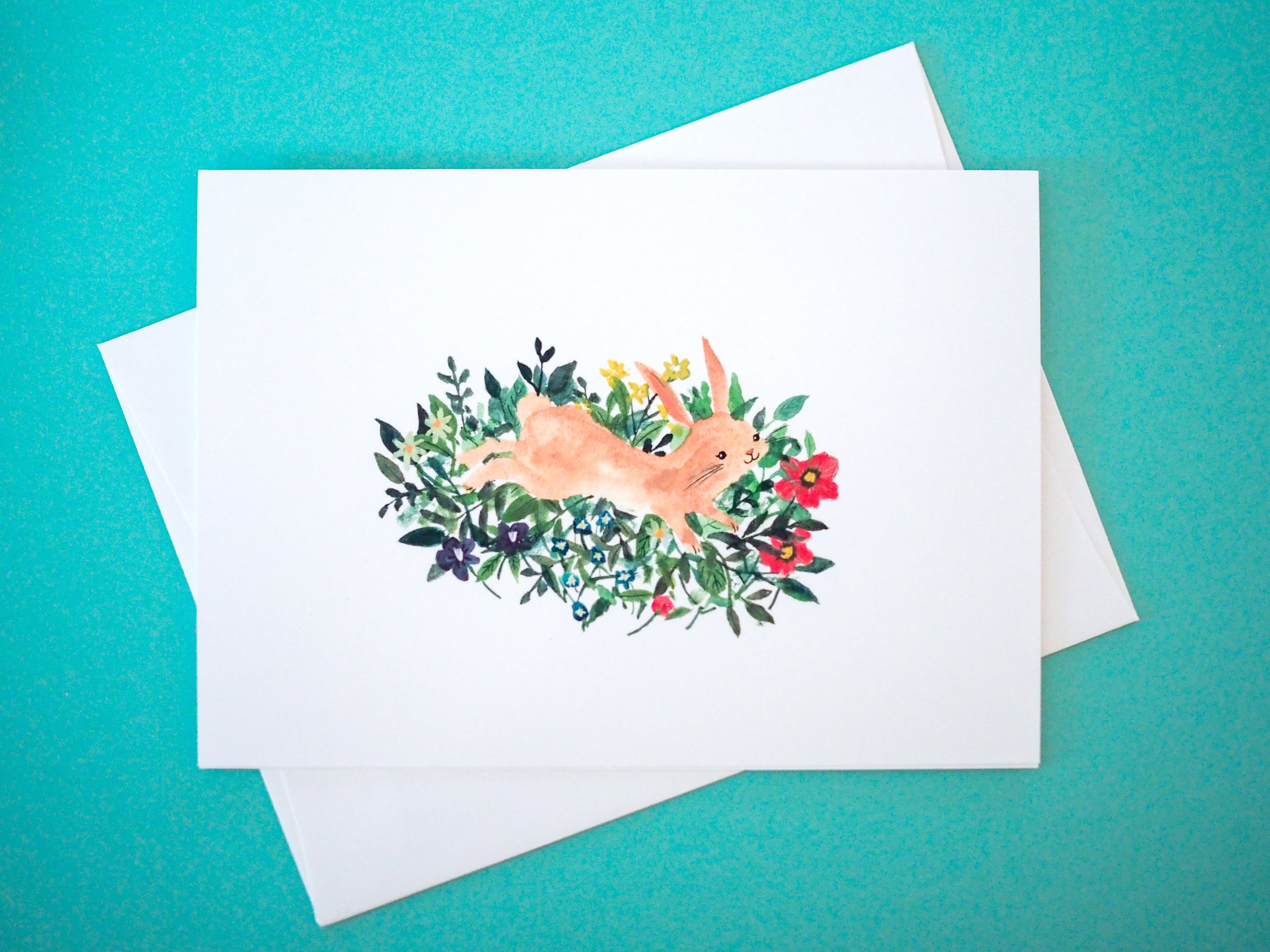 Bunny Jumping in Flowers Card
